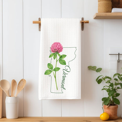 White microfiber tea towel with a pink clover bloom and green Vermont state outline.