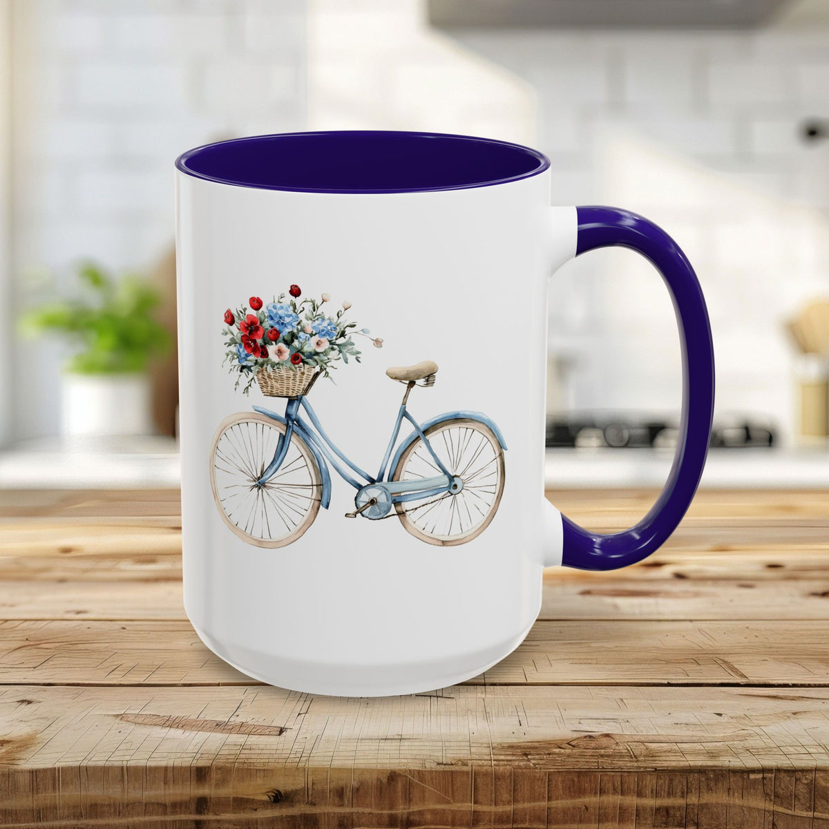 15oz white ceramic mug with blue handle and interior, featuring a watercolor vintage bicycle with floral basket.