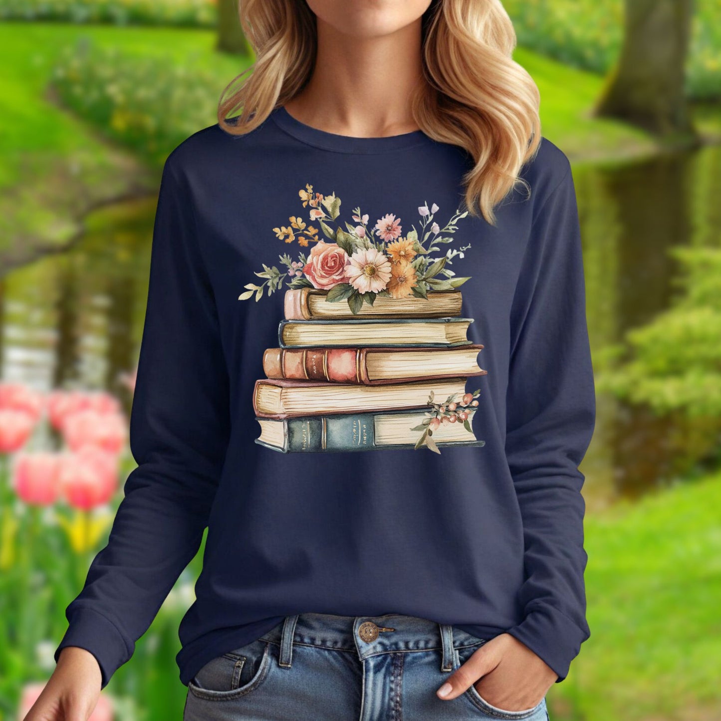 Navy long-sleeve tee with a vintage-feel cotton, featuring a stack of books blooming with delicate summer flowers.