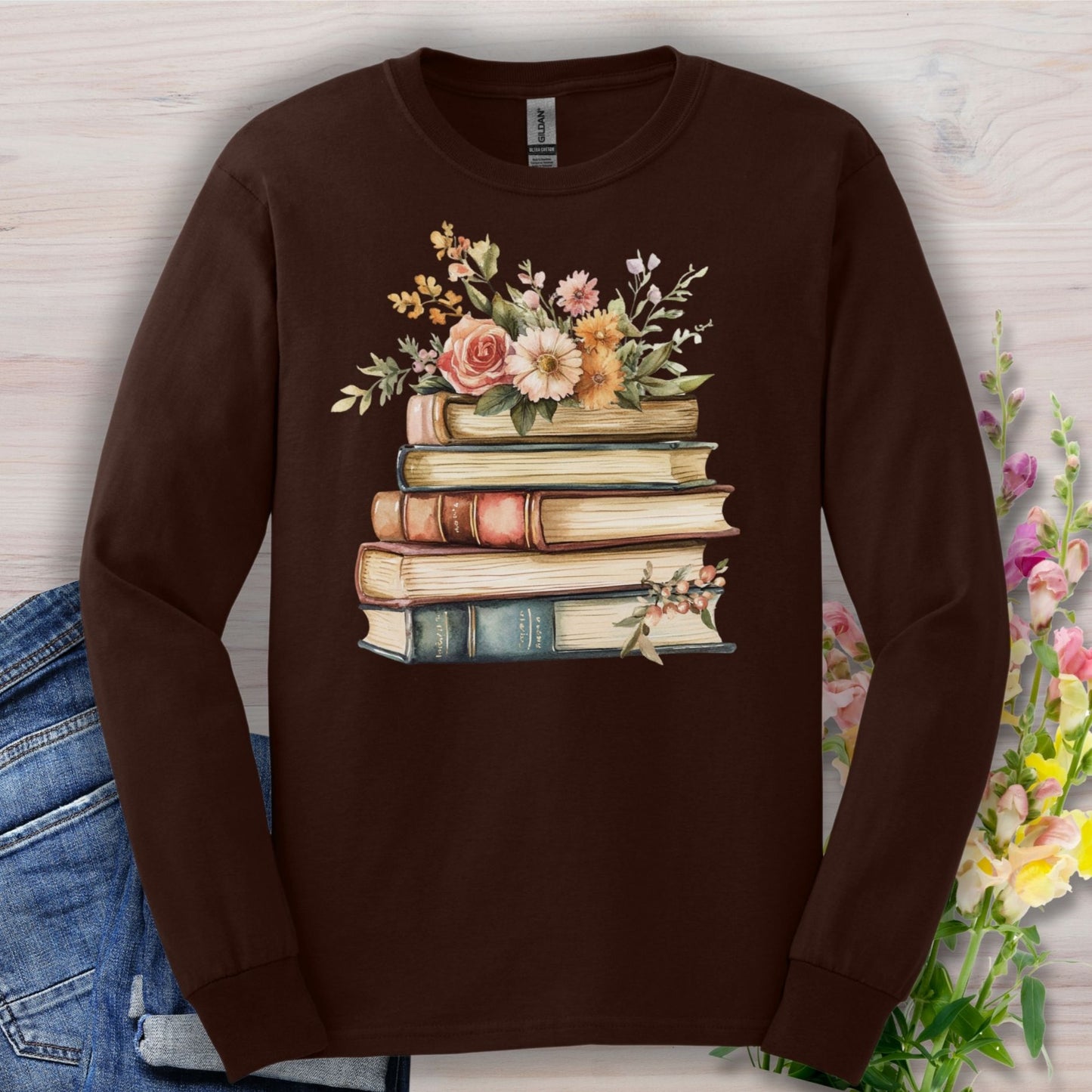 Dark Chocolate long sleeve tee with a vintage book stack and delicate summer flowers design.