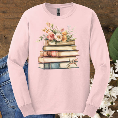 Light pink long sleeve tee with a vintage book and summer flower graphic, 100% USA-grown cotton.