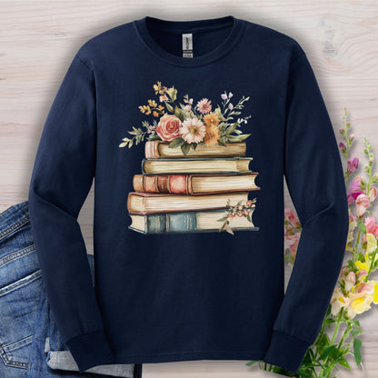 Navy long sleeve tee with a vintage book stack and delicate floral illustration.