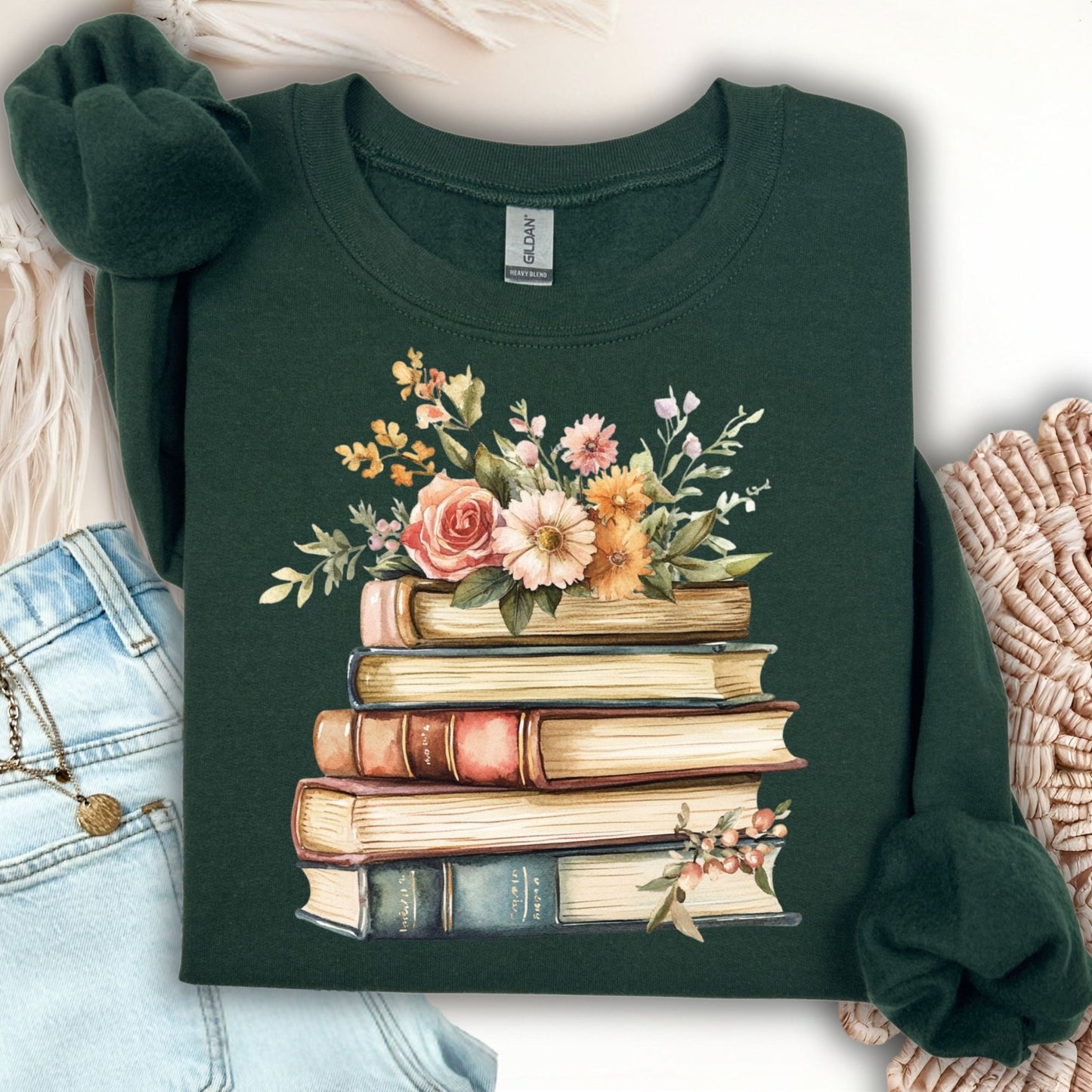 Forest Green sweatshirt with a vintage illustration of stacked books and delicate summer flowers.
