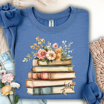 Indigo blue sweatshirt with a vintage books and summer flowers graphic.
