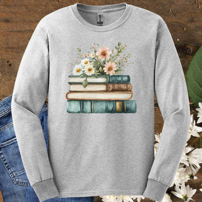 Ash gray long sleeve tee with a vintage stack of books and wildflowers print.