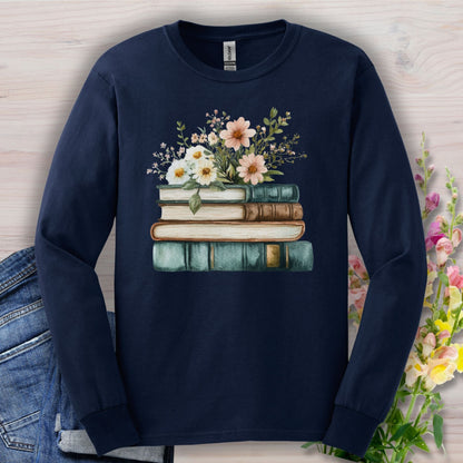 Navy long sleeve tee with a vintage stack of books and soft wildflowers print.