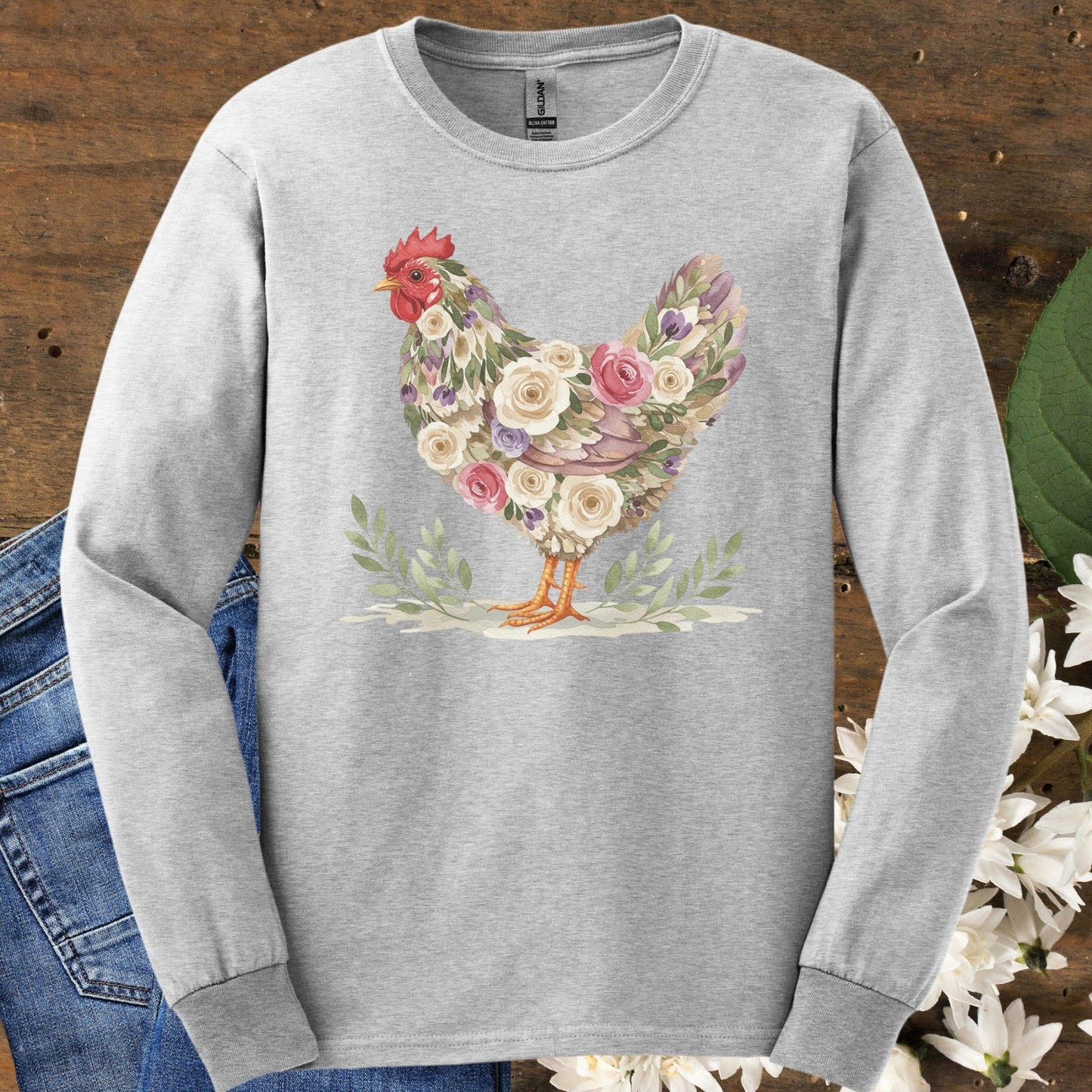 Ash long sleeve tee with a floral hen design in muted roses and greenery.
