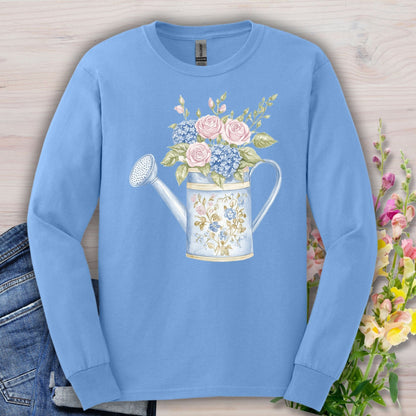 Carolina Blue long sleeve tee with a watercolor vintage watering can and pink roses, blue hydrangeas, and greenery.