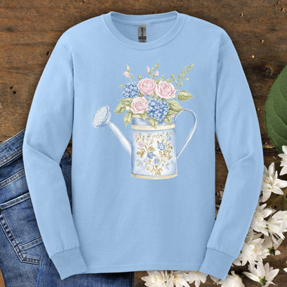 Light blue long sleeve tee with a vintage watering can and pink roses, blue hydrangeas, and greenery.