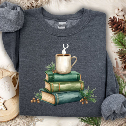 Dark gray long sleeve tee with a watercolor design of stacked vintage green books and a steaming coffee mug.
