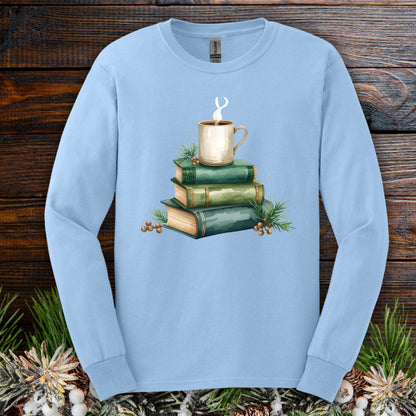 Light blue S long sleeve tee with a watercolor design of stacked vintage green books and a steaming coffee mug.