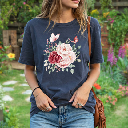 Woman wearing a relaxed-fit, navy garment-dyed tee with a watercolor peony and butterfly bouquet.