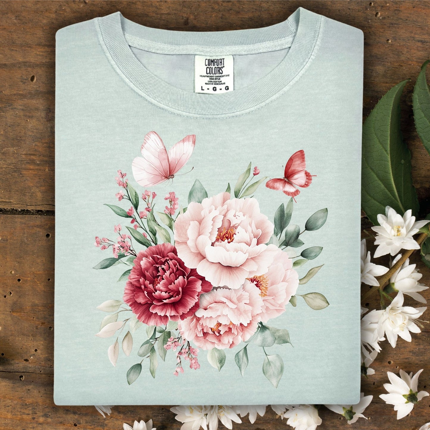 Bay S garment-dyed t-shirt with a watercolor peony and butterfly bouquet.