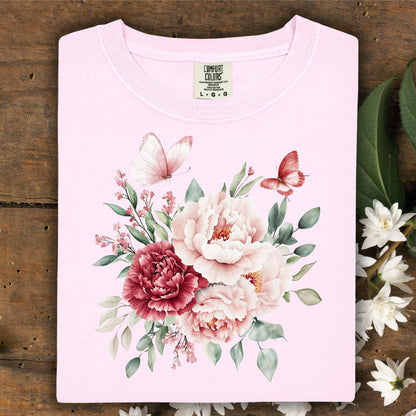 Blossom pink garment-dyed cotton t-shirt with a watercolor peony and butterfly bouquet design.