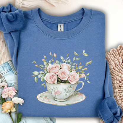 Indigo blue sweatshirt with vintage pink rose bouquet in a teacup design.