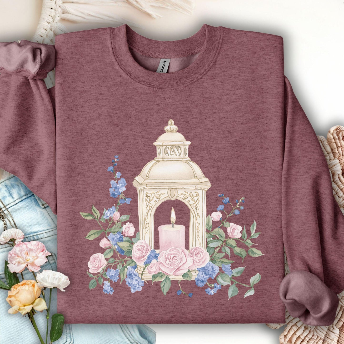 Heather Sport Dark Maroon sweatshirt with a vintage lantern, pink candle, and watercolor roses.