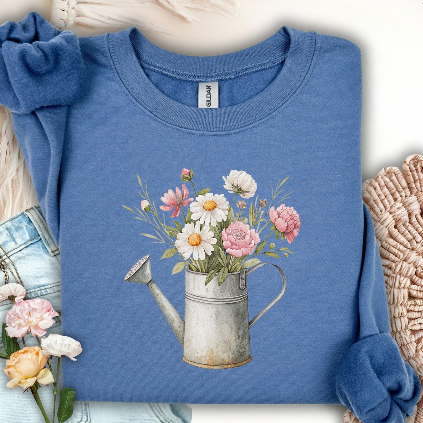 Indigo Blue sweatshirt with vintage watering can and mixed floral bouquet design.