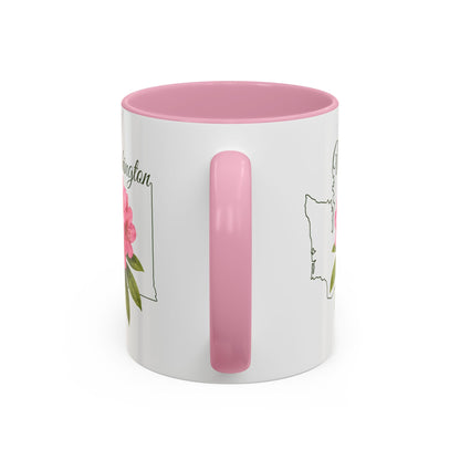White ceramic mug with pink interior and handle, featuring a hand-drawn Washington outline and pink rhododendron.