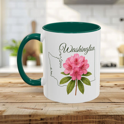 White ceramic mug with green handle and interior, featuring a pink rhododendron and Washington state outline.
