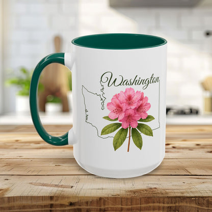 White ceramic mug with green handle and interior, featuring a pink rhododendron and Washington state outline.