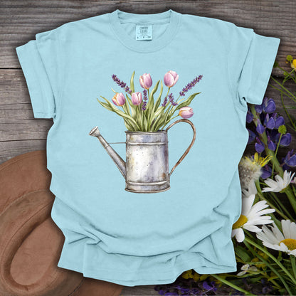 Chambray S t-shirt with vintage watering can, purple tulips, and lavender botanical illustration.