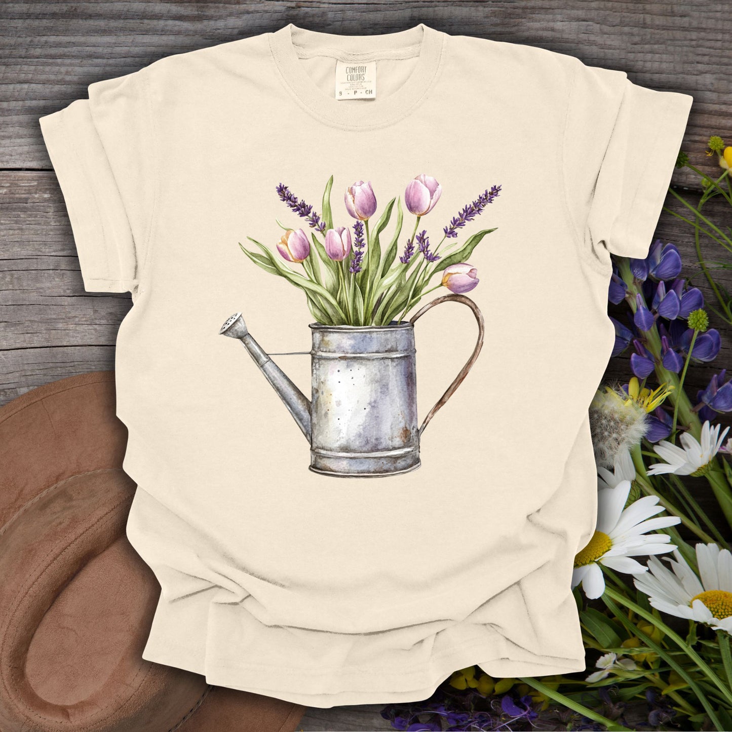 Ivory S t-shirt with a vintage watering can and purple tulips botanical illustration.