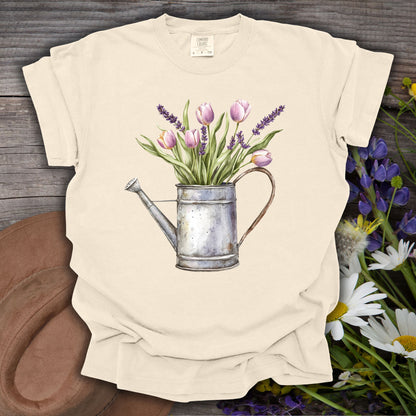 Ivory S t-shirt with a vintage watering can and purple tulips botanical illustration.