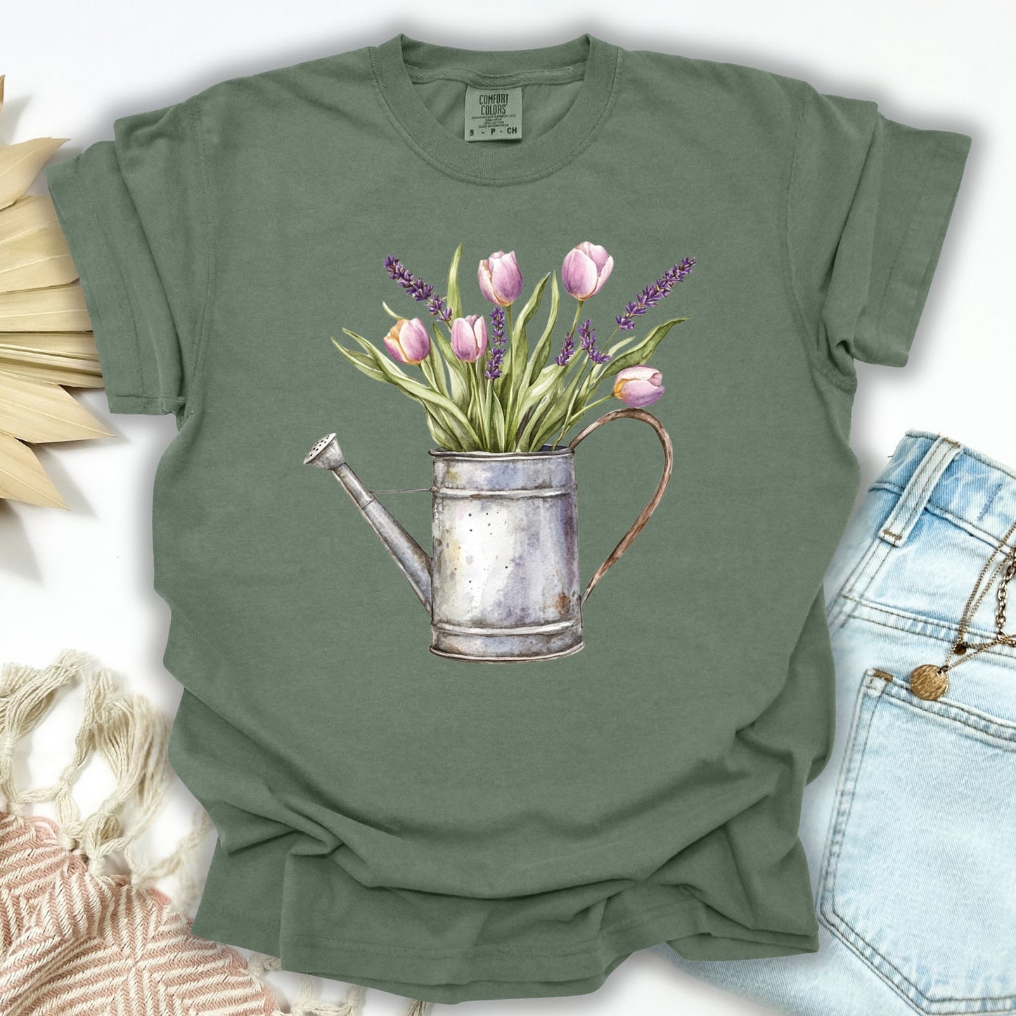 Moss S t-shirt with a vintage watering can and purple tulips illustration.