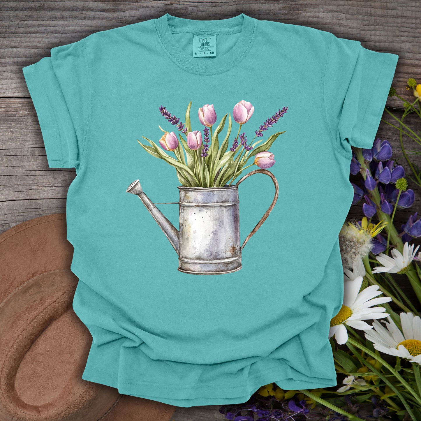 Seafoam S t-shirt with a vintage watering can and purple tulips botanical illustration.