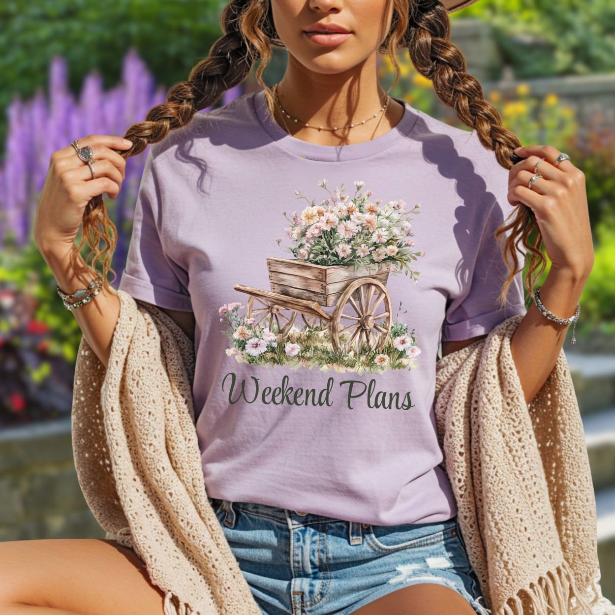 Lavender garment-dyed cotton t-shirt with a watercolor gardening wagon and "Weekend Plans" text.