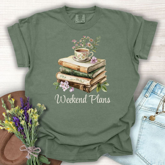 Moss green "Weekend Plans" t-shirt with a watercolor stack of vintage books, teacup, and flowers.