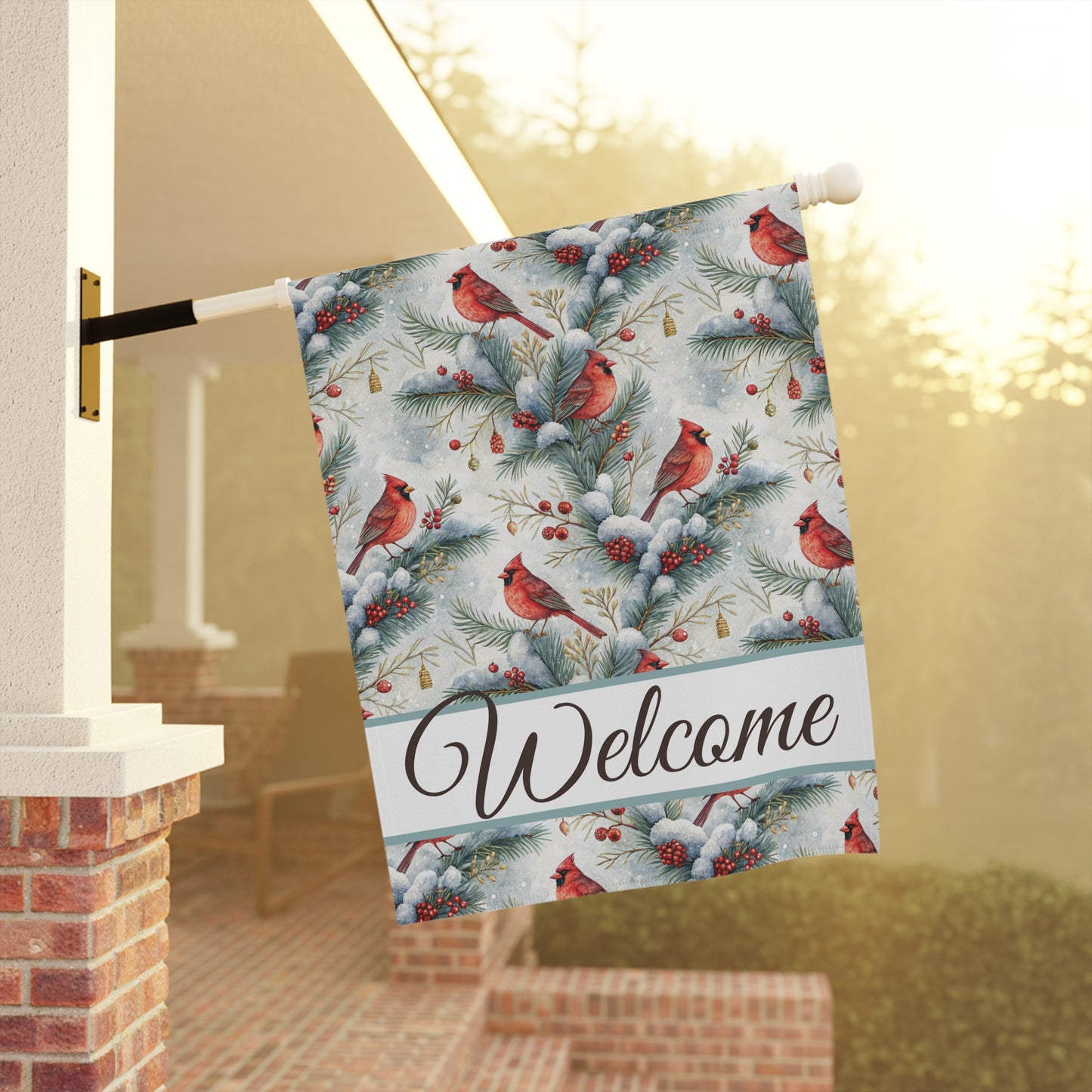 Watercolor cardinal garden flag with snowy evergreens, red berries, and "Welcome" script.