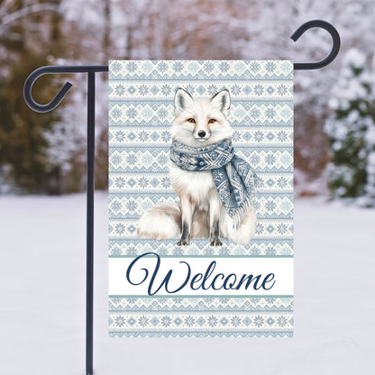 Winter fox garden flag, 12"x18", with Fair Isle pattern, "Welcome" text, and white fox in blue scarf.