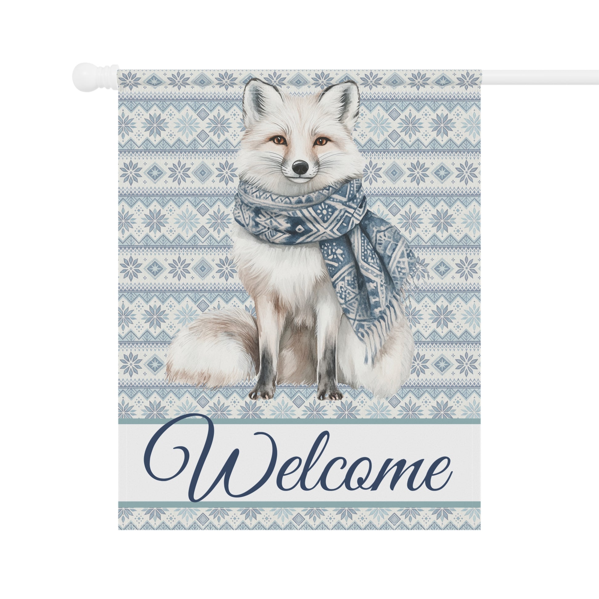 Winter fox garden flag with a white fox wearing a blue Fair Isle scarf, "Welcome" text, and snowflake pattern.