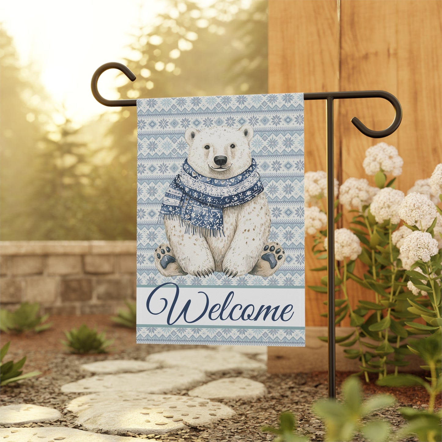 Watercolor polar bear in a blue Fair Isle scarf on a garden flag with "Welcome" text.