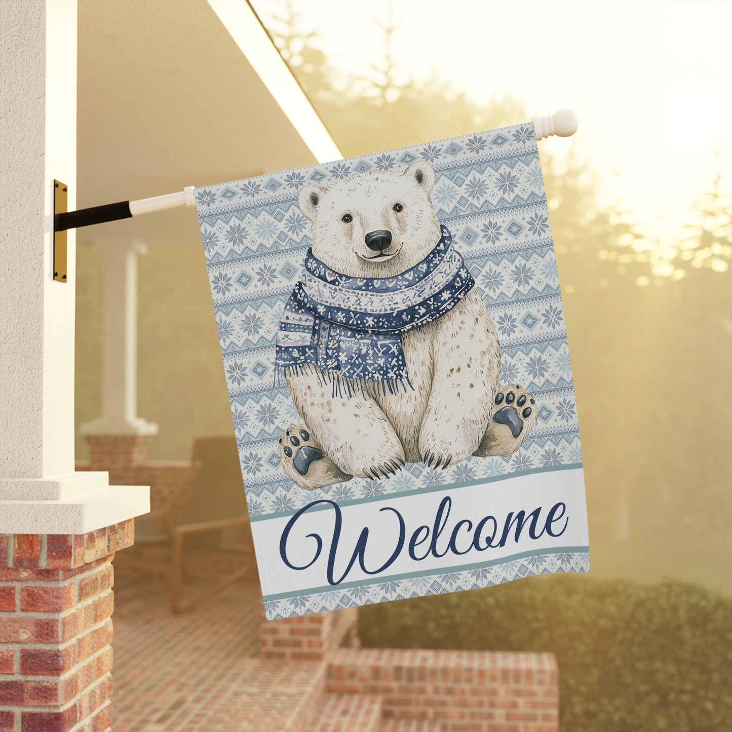 Watercolor polar bear in a blue scarf on a Fair Isle garden flag with "Welcome" text.