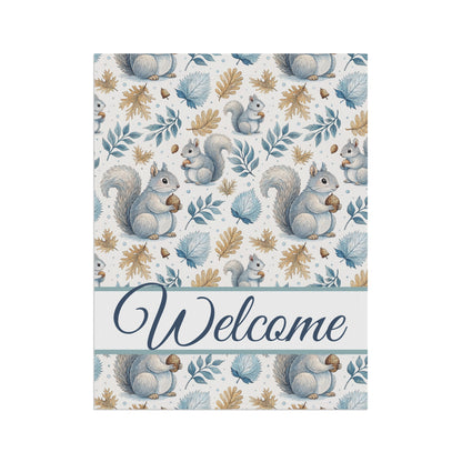 Watercolor garden flag with gray squirrels, blue and gold foliage, and a "Welcome" script.