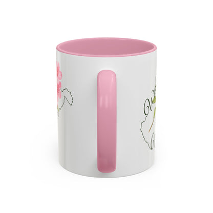White ceramic 11oz mug with pink handle and interior, featuring a watercolor rhododendron and West Virginia silhouette.