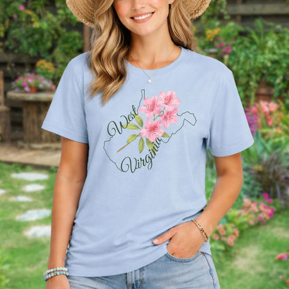 Light blue garment-dyed t-shirt with a watercolor rhododendron and West Virginia state outline.