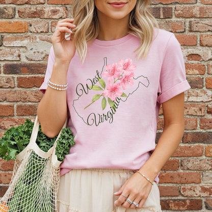 Pink garment-dyed cotton t-shirt with a watercolor rhododendron inside the West Virginia state outline.