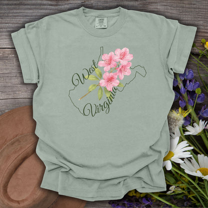 Bay green garment-dyed cotton t-shirt with a watercolor rhododendron inside the West Virginia outline.