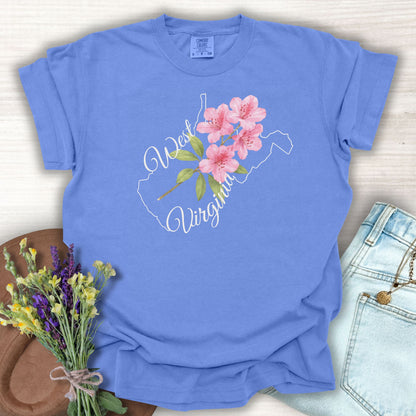 Periwinkle S garment-dyed cotton t-shirt with a white West Virginia outline and watercolor rhododendron.