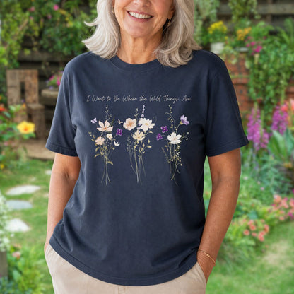 Relaxed-fit navy garment-dyed cotton t-shirt featuring watercolor purple wildflowers and hand-lettered text on the chest.