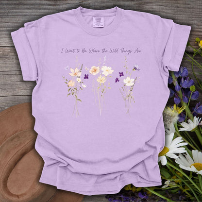 Orchid purple garment-dyed cotton t-shirt featuring watercolor wildflowers and the text I Want to Be Where the Wild Things Are.