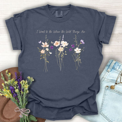 Denim blue garment-dyed cotton t-shirt featuring watercolor wildflowers and the text I Want to Be Where the Wild Things Are.