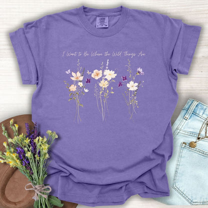 Grape purple garment-dyed cotton t-shirt featuring watercolor wildflowers and the text I Want To Be Where The Wild Things Are.