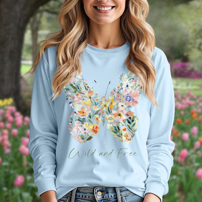 Light blue long-sleeve tee with a watercolor wildflower butterfly and "Wild and Free" text.