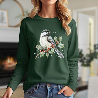 Dark green long sleeve tee with a watercolor black-capped chickadee on a snowy holly branch.