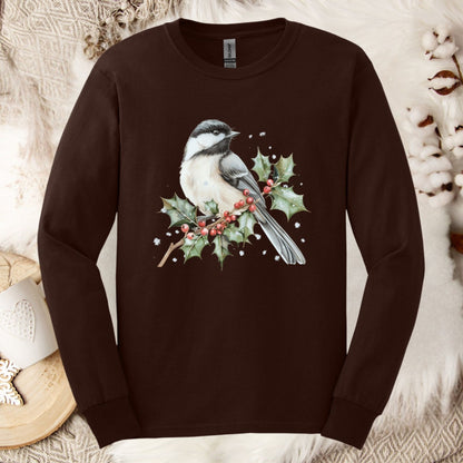 Dark chocolate long sleeve tee with a watercolor chickadee on a snow-dusted holly branch with red berries.