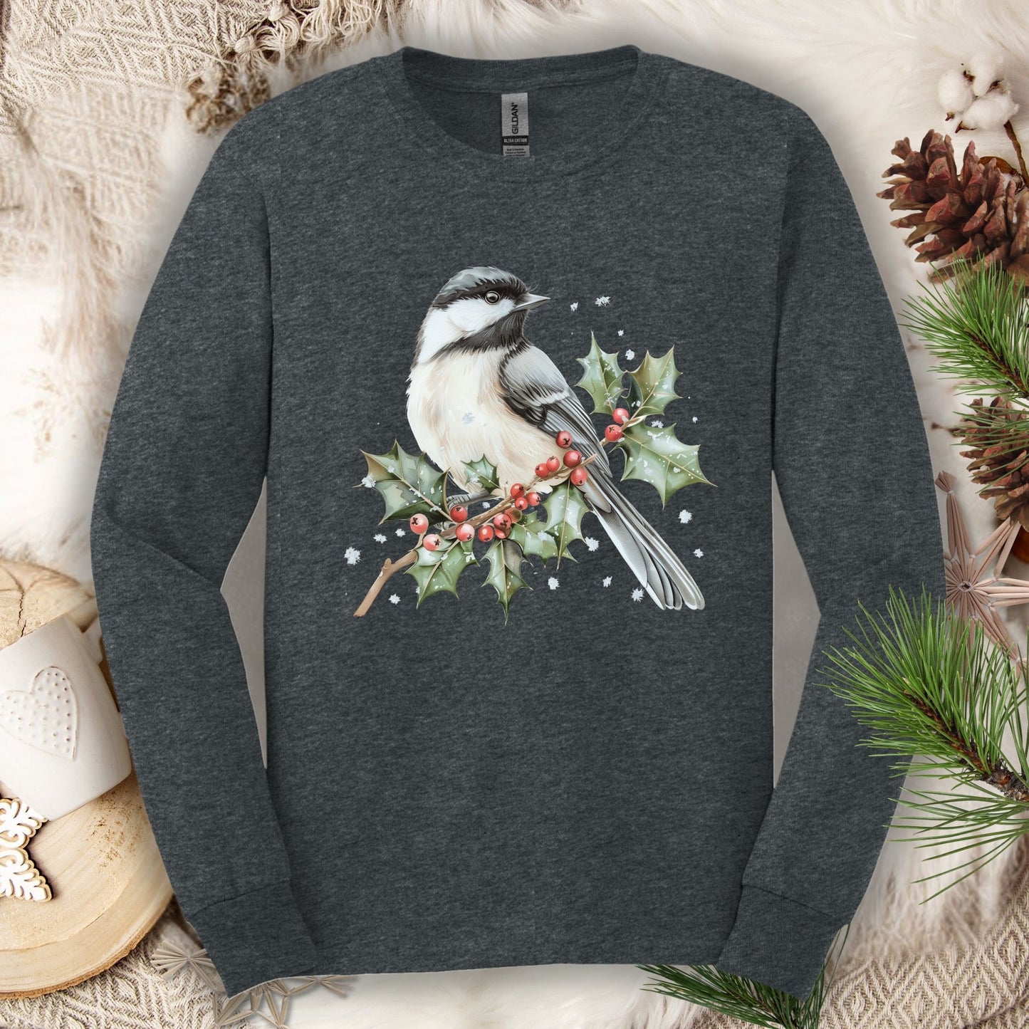 Dark Heather long sleeve tee with watercolor chickadee on snowy holly branch.